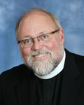 Rev. Dr. Robert A. Davis smiling